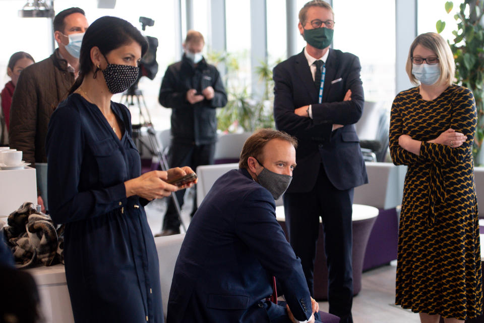 Matt Hancock (centre, sitting) with adviser Gina Coladangelo (left) at the launch of Pfizer's Vaccine Centre of Excellence at the University of Bristol on 25 May. (PA)