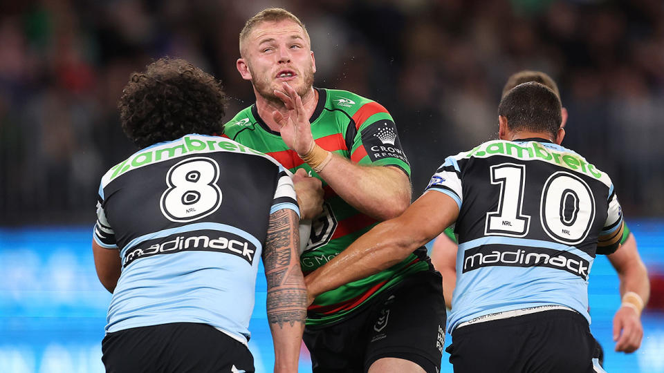 Pictured here, Souths prop Tom Burgess in action against the Sharks in round 23 of the NRL. 