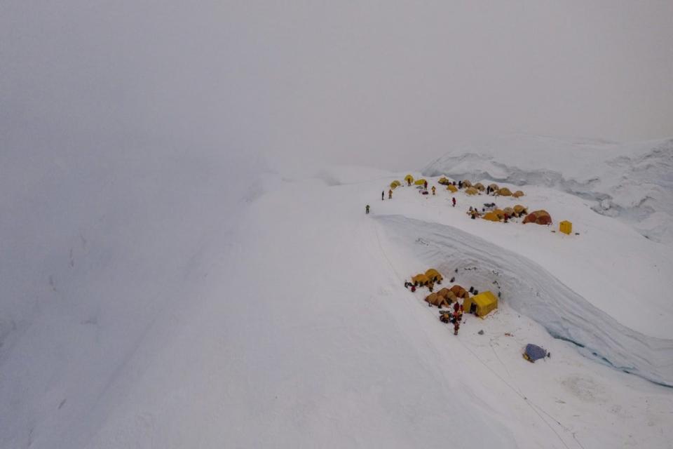 <div class="inline-image__caption"><p>Just before a storm, tents from several expeditions huddle against the snowy slope in this drone shot of the North Col camp at about 23,000 feet. But the hurricane-force winds that followed proved too strong, blasting down every tent. At least one was carried hundreds of feet into the air. </p></div> <div class="inline-image__credit">National Geographic/Renan Ozturk</div>