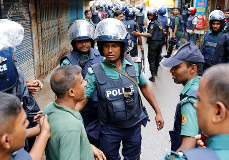 Police keep the public away near the site of a police operation on militants on the outskirts of Dhaka, Bangladesh, July 26, 2016. REUTERS/Mohammad Ponir Hossain