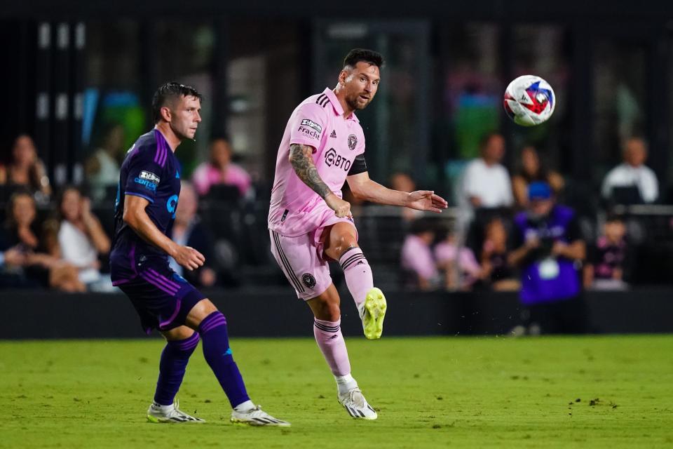 Inter Miami CF forward Lionel Messi (10) controls the ball as Charlotte FC midfielder Brandt Bronico (13) defends in the first half.
