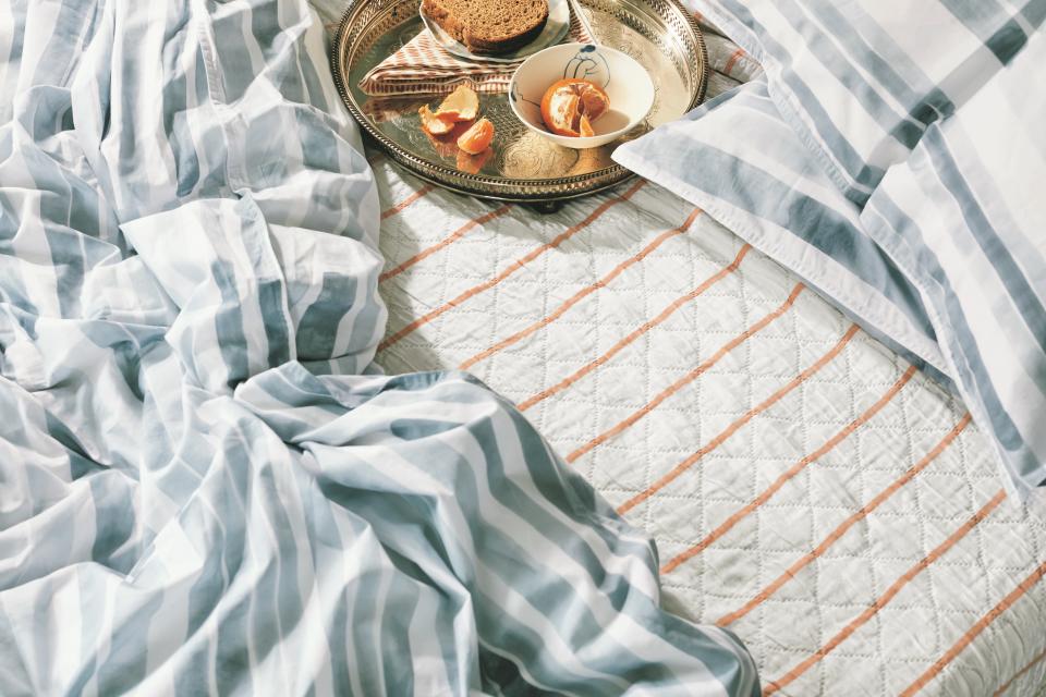 An easy way to add color, pattern, and interest into your space is through textiles. A stripe, a color block, a pastel, a jewel tone…just think about balance and proportions, and get mixing.