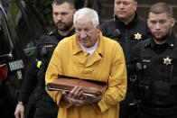 Former Penn State University assistant football coach Jerry Sandusky, center, arrives at the Centre County Courthouse to be resentenced Friday, Nov. 22, 2019, in Bellefonte, Pa. Sandusky was convicted of 45 counts of child sexual abuse in 2012 and sentenced to 30 to 60 years. (AP Photo/Gene J. Puskar)