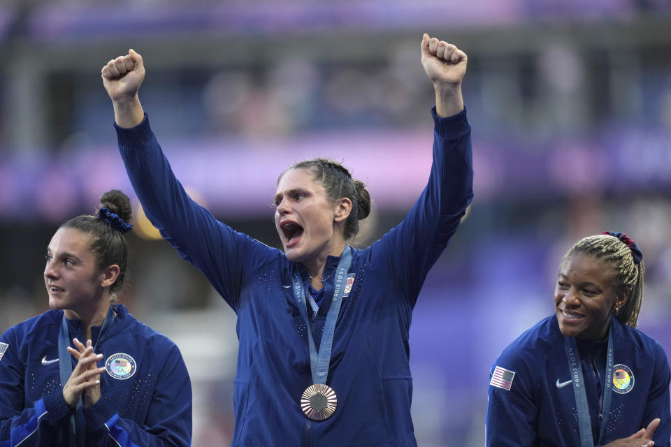 United States' Ilona Maher, centre reacts as she stands on the podium with her bronze medal during the presentation ceremony Rugby Sevens at the 2024 Summer Olympics, in the Stade de France, in Saint-Denis, France, Tuesday, July 30, 2024. (AP Photo/Tsvangirayi Mukwazhi)