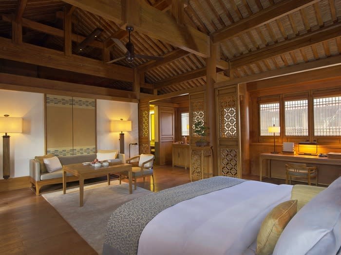 Spacious suite: The Amandayan hotel consists of traditional courtyard buildings and presents 35 spacious suites with terraces and views of Lijiang, the surrounding countryside and far-off, snow-capped mountains.