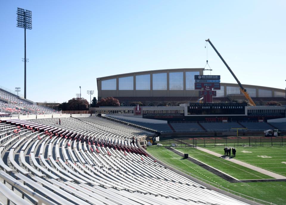 Crews prepare to remove the Double T scoreboard at Jones AT&T Stadium. The initial attempt Thursday afternoon was delayed and the crane repositioned. The scoreboard was successfully lifted by crane and removed Thursday night.
