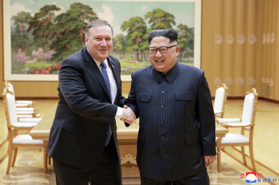 FILE - In this May 9, 2018, file photo provided by the North Korean government, U.S. Secretary of State Mike Pompeo, left, shakes hands with North Korean leader Kim Jong Un during a meeting at Workers' Party of Korea headquarters in Pyongyang, North Korea. North Korea warned Washington through its state media Tuesday, Oct. 2, that a declaration ending the Korean War shouldn't be seen as a bargaining chip in denuclearization talks — but suggested lifting sanctions might be. Independent journalists were not given access to cover the event depicted in this image distributed by the North Korean government. The content of this image is as provided and cannot be independently verified. Korean language watermark on image as provided by source reads: "KCNA" which is the abbreviation for Korean Central News Agency. (Korean Central News Agency/Korea News Service via AP, File)