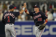 Washington Nationals right fielder Alex Call (62) celebrates with second baseman Cesar Hernandez after the Nationals defeated the San Diego Padres 6-3 in a baseball game Friday, Aug. 19, 2022, in San Diego. (AP Photo/Gregory Bull)