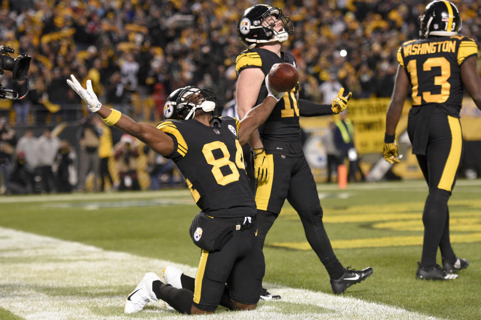 Pittsburgh Steelers wide receiver Antonio Brown (84) celebrates with Ryan Switzer (10) after catching a touchdown pass from quarterback Ben Roethlisberger during the first half of an NFL football game against the New England Patriots in Pittsburgh, Sunday, Dec. 16, 2018. (AP Photo/Don Wright)