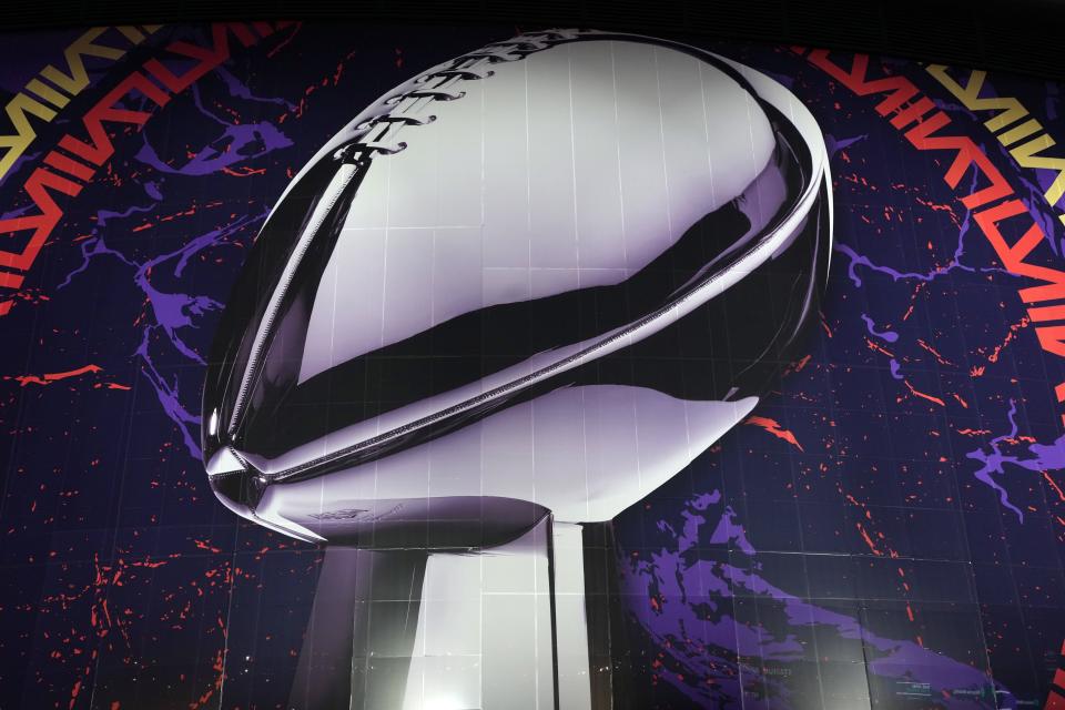 Feb 9, 2024; Las Vegas, NV, USA; A graphic of Vince Lombardi trophy on the Allegiant Stadium facade prior to Super Bowl 58 between the San Francisco 49ers and the Kansas City Chiefs. Mandatory Credit: Kirby Lee-USA TODAY Sports