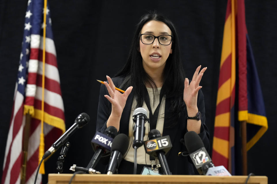 Media pool witness Taylor Tasler from KTAR talks to the media on Wednesday, May 11, 2022, in Florence, Ariz. Inmate Clarence Dixon was put to death by lethal injection earlier Wednesday inside the state prison for his murder conviction in the killing of 21-year-old Arizona State University student Deana Bowdoin in 1978. Dixon was the first person to be executed in the state after a nearly eight-year hiatus in its use of the death penalty. (AP Photo/Rick Scuteri)