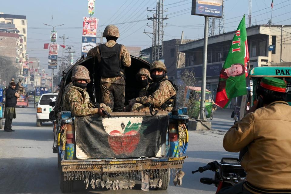 Pakistani soldiers on patrol in Peshawar on February 7, a day before the national elections (Abdul Majeed / AFP via Getty Images)
