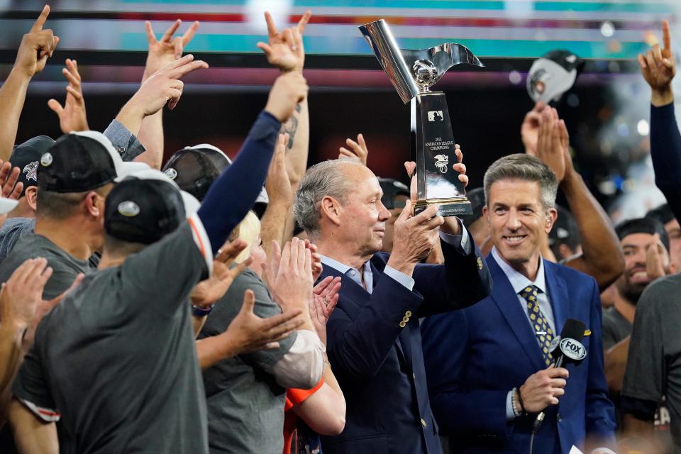 Houston Astros owner Jim Crane hold the trophy after defeating the Boston Red Sox to advance to the World Series after game six of the 2021 ALCS at Minute Maid Park.