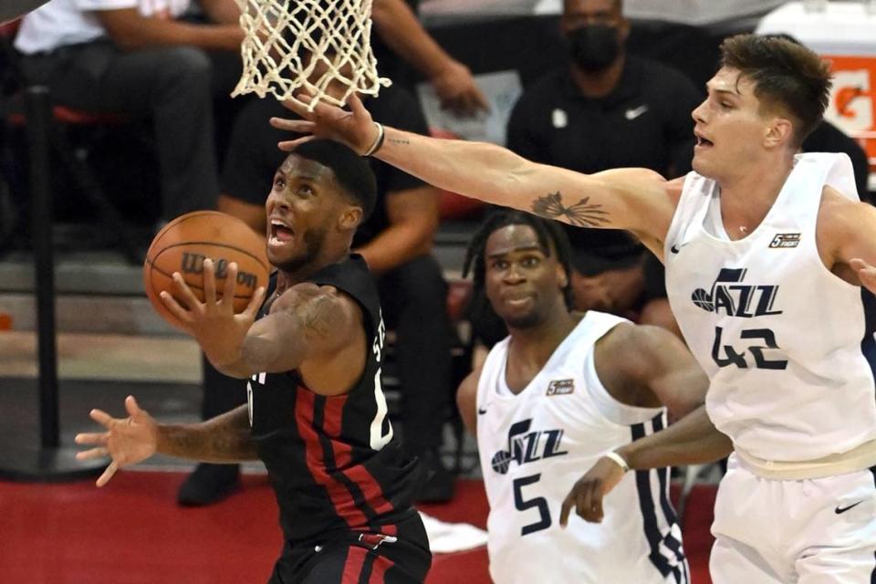 Former Kentucky player Nate Sestina, right with the Jazz, tries to block a shot by the Heat’s D.J. Stewart Jr. during an NBA summer league game on Friday.