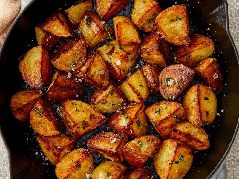 Crispy skillet fried potatoes in skillet.