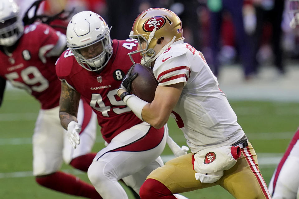 San Francisco 49ers quarterback C.J. Beathard (3) runs as Arizona Cardinals linebacker Kylie Fitts (49) pursues during the first half of an NFL football game, Saturday, Dec. 26, 2020, in Glendale, Ariz. (AP Photo/Ross D. Franklin)