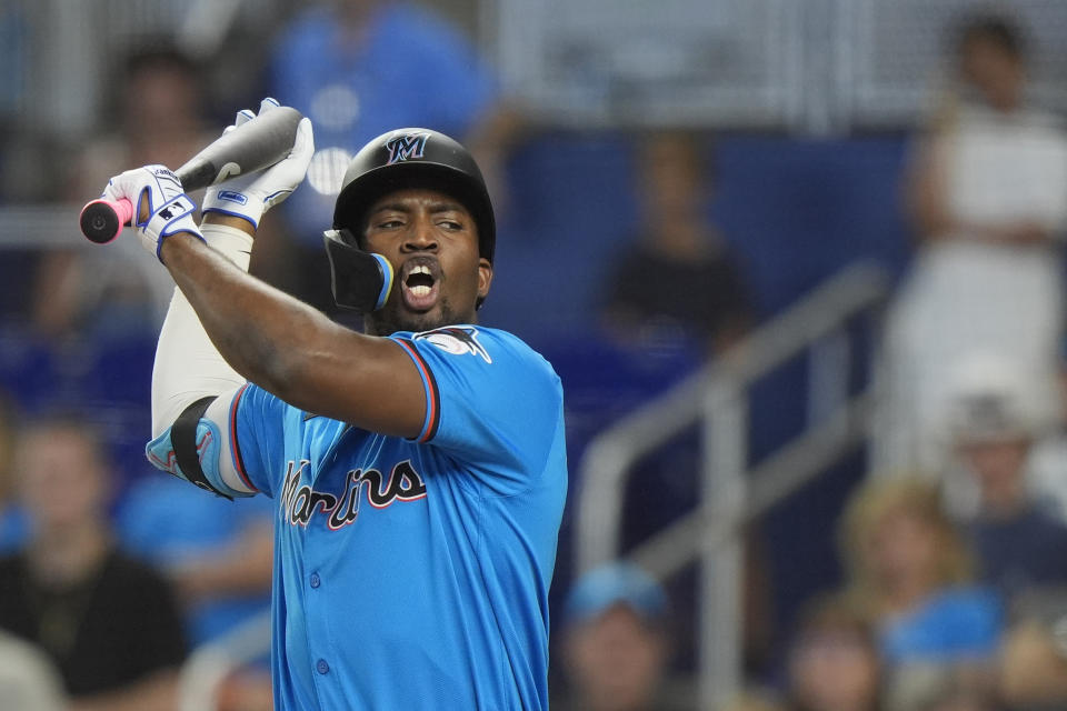 Miami Marlins' Jesus Sanchez reacts after being walked during the first inning of a baseball game against the Seattle Mariners, Sunday, June 23, 2024, in Miami. (AP Photo/Wilfredo Lee)