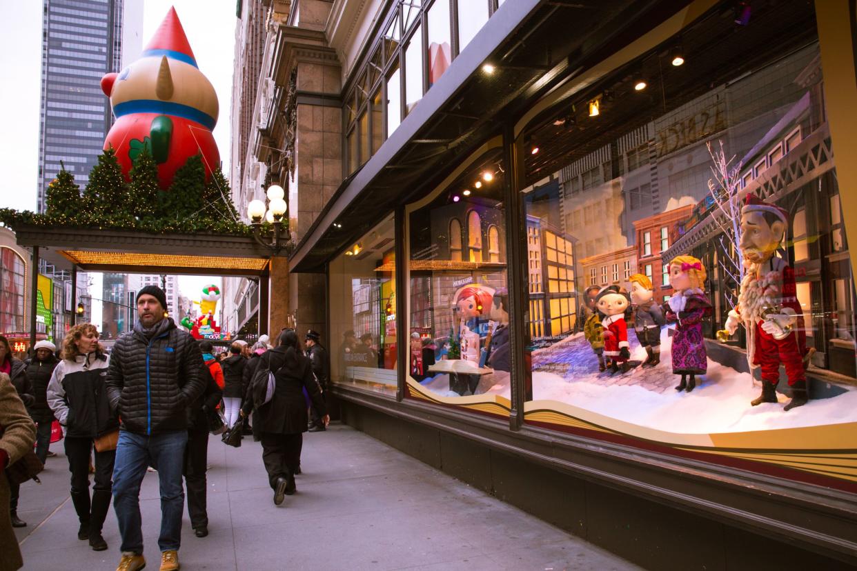 New York City, New York, USA - November 29, 2014: View of Christmas holiday window display at historic Macy's Herald Square in midtown Manhattan with people present.  This years theme is