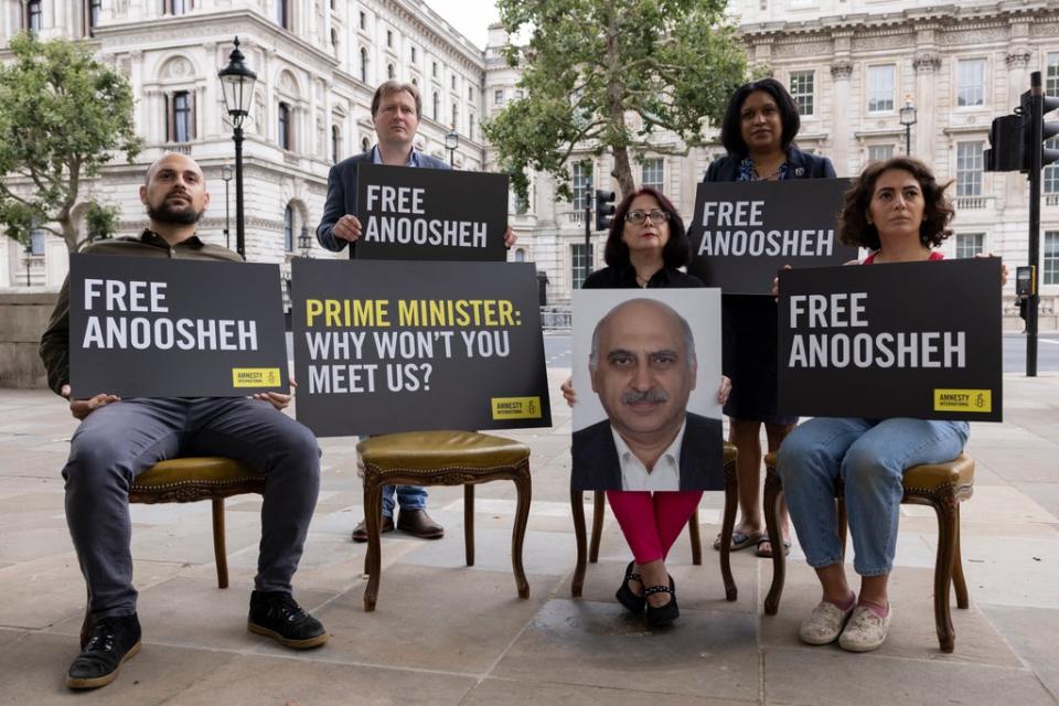 The family of Anoosheh Ashoori, a british man currently jailed in Iran, staged an an empty chair protest opposite Downing Street to 'highlight the need for Boris Johnson to meet them to discuss his plight.' They were joined by Richard Ratcliffe, the husband of Nazanin Zaghari-Ratcliffe and MP for Lewisham East Janet Daby. (Getty Images)