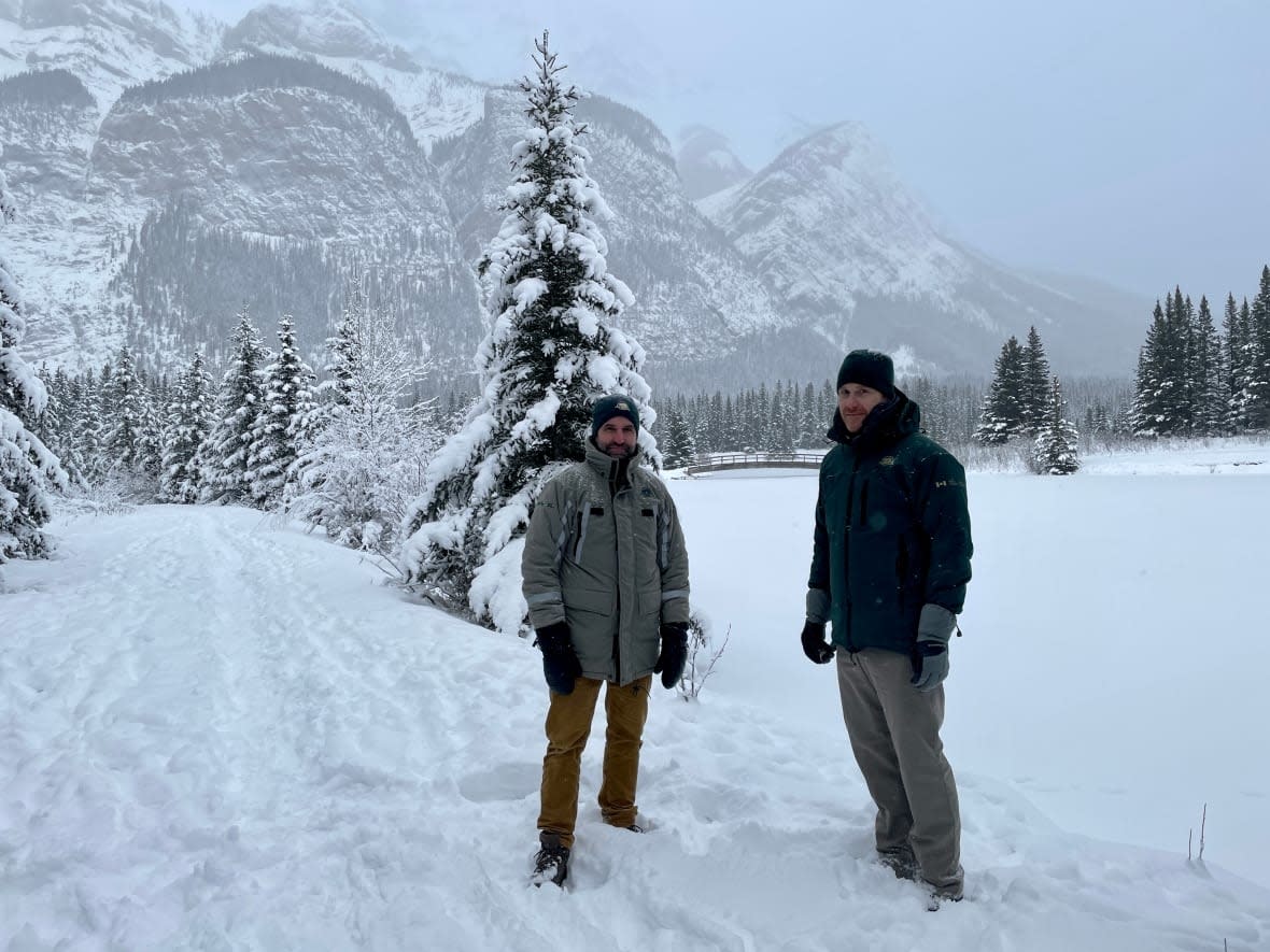 Steven Guilbeault, left, visited Cascade Ponds in Banff National Park Saturday to announce almost $15 million in funding to fight invasive species. (Evelyne Asselin/CBC - image credit)