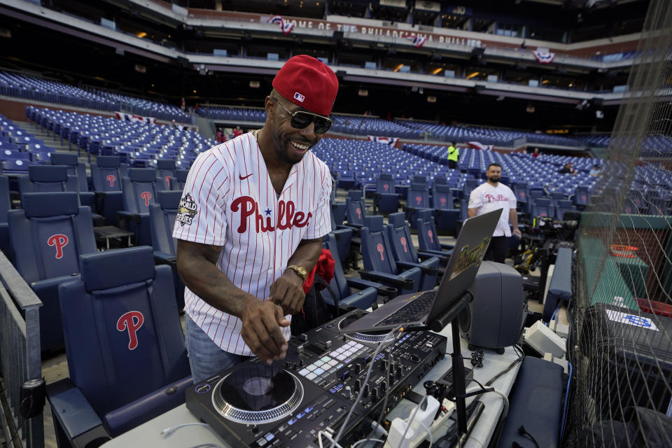 Everett DJ Hollywood plays music before Game 3 of baseball's World Series between the Houston Astros and the Philadelphia Phillies on Tuesday, Nov. 1, 2022, in Philadelphia. (AP Photo/David J. Phillip)