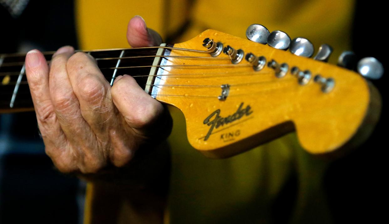 Oklahoma country singer Jude Northcutt, of "Jude 'n' Jody,“ plays Sept. 4, 2015, during an interview at Jude 'n' Jody & Sons Furniture in Oklahoma City. Jude liked wearing his longtime partner's, Jody Taylor's cowboy hat and playing his guitar when he performs.