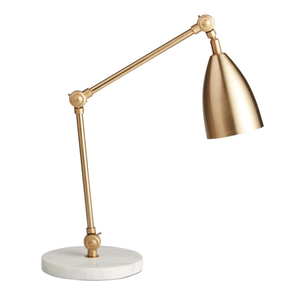 You can shift this mid-century modern lamp around whenever you feel like moving at your desk. It has a natural white marble base, an adjustable gold pedestal and shade. You'll need to get a 60-watt or <a href="https://fave.co/3mnZQlj" target="_blank" rel="noopener noreferrer">13-watt CFL light bulb</a> to go with it. <a href="https://fave.co/3kjlGVf" target="_blank" rel="noopener noreferrer">Find it for $60 at World Market</a>.