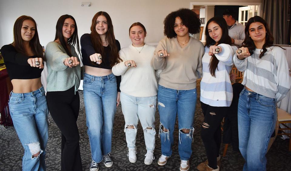 The Case girls show off their rings at the Case softball championship banquet at the Fall River Country Club Sunday Nov. 26, 2023.