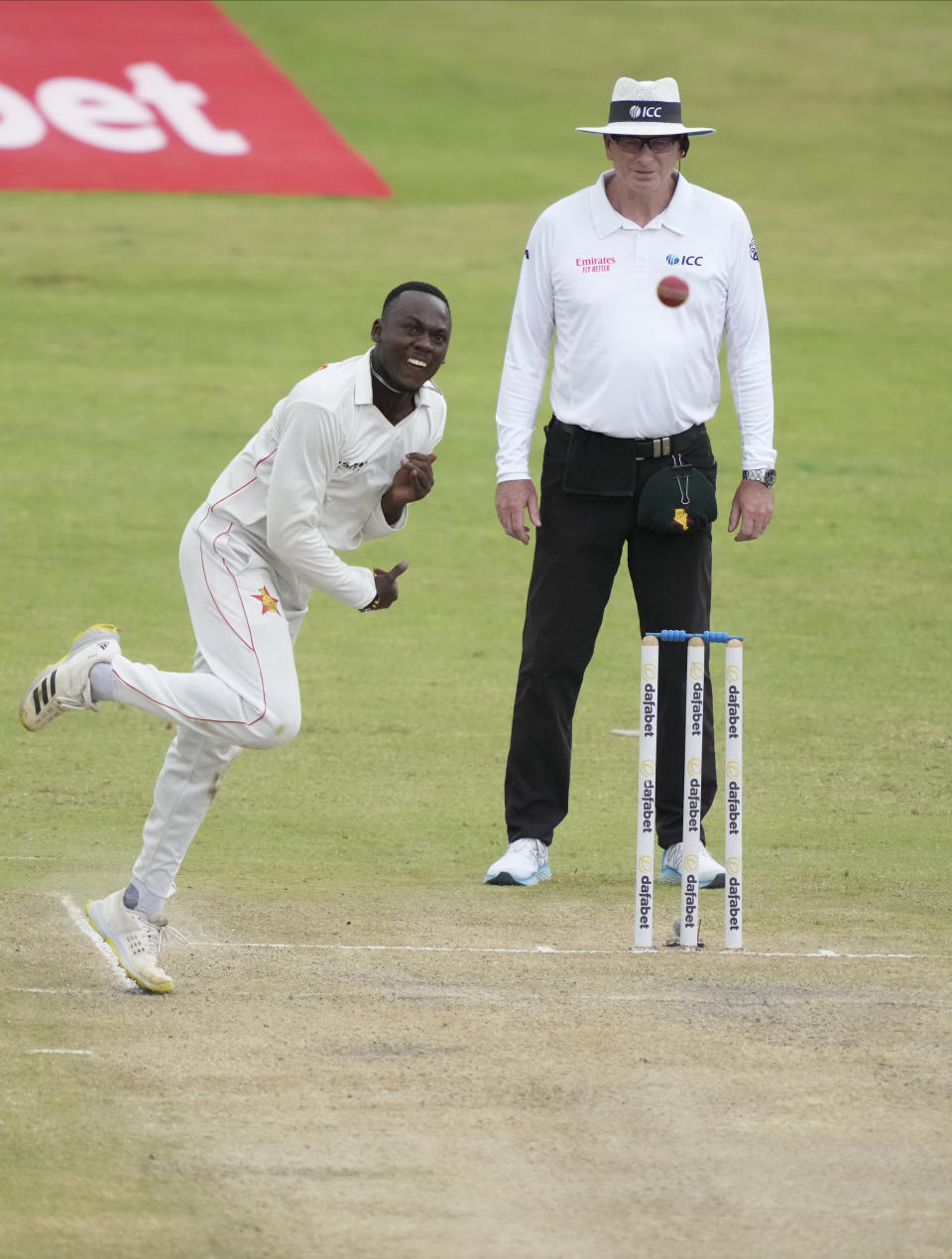 Zimbabwe bowler Brandon Mavuta in action on the first day of the second Test Cricket match between Zimbabwe and West Indies at Queens Sports Club in Bulawayo, Zimbabwe, Sunday, Feb. 12, 2023. (AP Photo/Tsvangirayi Mukwazhi)