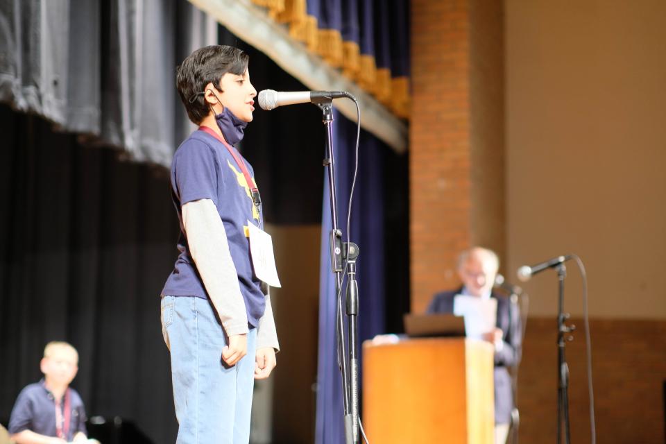 The 2022 Potter County Spelling Bee Champ Arnie Parat shows his spelling excellence to the crowd and judges Thursday at the annual competition.