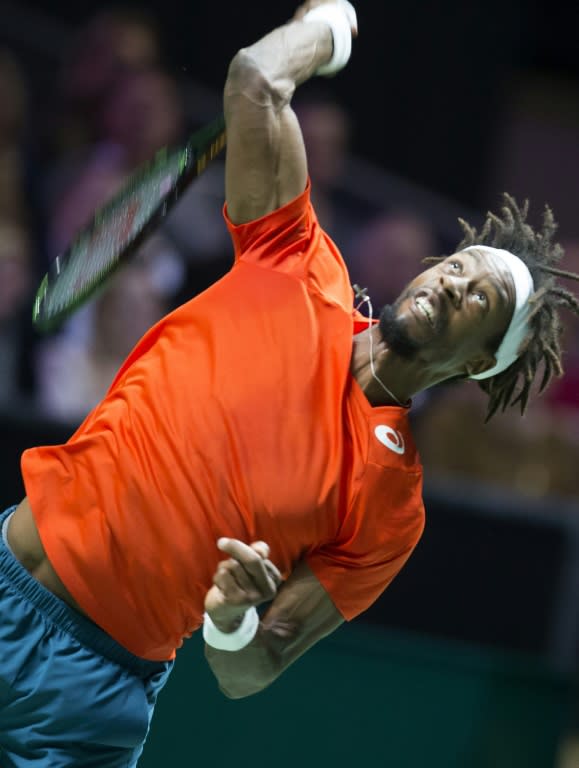 France's Gael Monfils serves to Germany's Philipp Kohlschreiber during their Rotterdam ATP tournament tennis match, on February 13, 2016