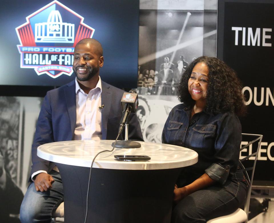 Marcus Mills and Melanie Mills, the son and wife of the late Sam Mills Jr., speak to the media at the Pro Football Hall of Fame in Canton on Monday, March 14, 2022. Sam Mills Jr. is a member of the Class of 2022.