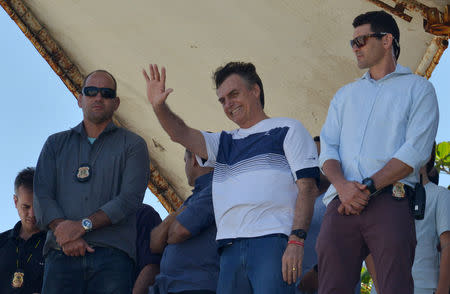 Brazil's new president-elect, Jair Bolsonaro, waves to supporters as he watches airplanes performing near his condominium at Barra da Tijuca neighbourhood in Rio de Janeiro, Brazil October 31, 2018. REUTERS/Lucas Landau