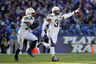 <p>Los Angeles Chargers defensive back Adrian Phillips, right, celebrates with teammate Rayshawn Jenkins after intercepting a pass in the first half of an NFL wild card playoff football game against the Baltimore Ravens, Sunday, Jan. 6, 2019, in Baltimore. (AP Photo/Carolyn Kaster) </p>