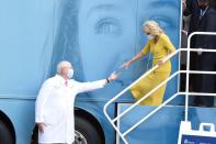 Dr. Raymond DuBois, MUSC Hollings Cancer Center director, left, extends a hand to first lady Jill Biden as she exits a mobile mammography unit during a tour of the facility on Monday, Oct. 25, 2021, in Charleston, S.C. (AP Photo/Meg Kinnard)