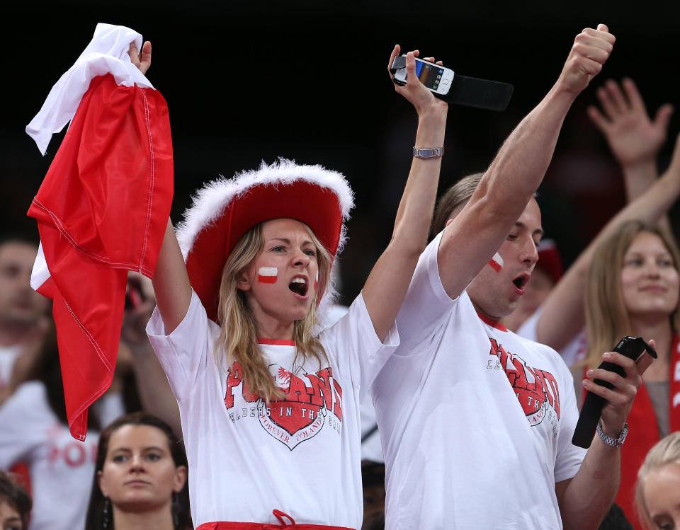 LONDON, ENGLAND - JULY 29: Poland fans cheer on their team as they take on Italy during Men's Volleyball on Day 2 of the London 2012 Olympic Games at Earls Court on July 29, 2012 in London, England. (Photo by Elsa/Getty Images)