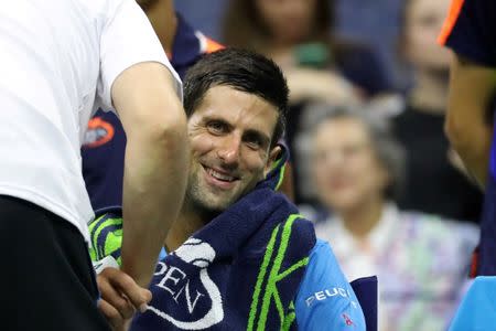 Sep 4, 2016; New York, NY, USA; Novak Djokovic of Serbia receives treatment from an ATP trainer during a changeover against Kyle Edmund of Great Britain (not pictured) on day seven of the 2016 U.S. Open tennis tournament at USTA Billie Jean King National Tennis Center. Mandatory Credit: Geoff Burke-USA TODAY Sports