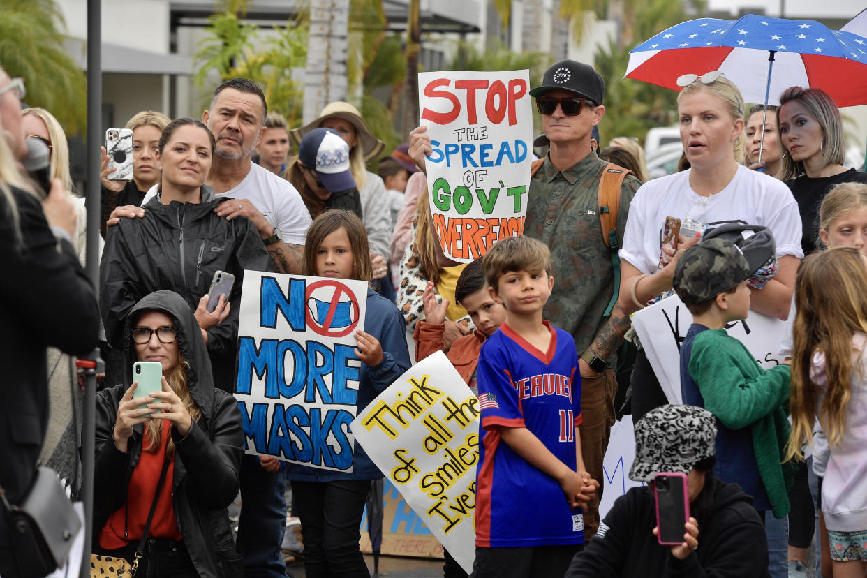 Protesters gather at an anti-mask rally outside the Orange County Department of Education in Costa Mesa, Calif., in May.