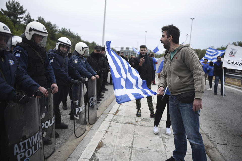 A Greek protester chant slogans against Greece's name deal with neighboring Macedonia, during a rally near Evzonoi border crossing in Greece, Sunday, Sept. 30, 2018. Macedonians were deciding on their country's future Sunday, voting whether to accept a landmark deal ending a decades-long dispute with neighboring Greece by changing their country's name to North Macedonia. (AP Photo/Giannis Papanikos)