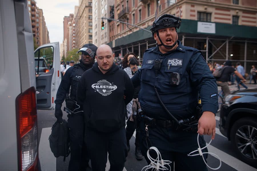 Police arrest a Palestinian protester during the Met Gala near the Metropolitan Museum of Art where the Met Gala takes place, on Monday, May 6, 2024, in New York. (AP Photo/Andres Kudacki)