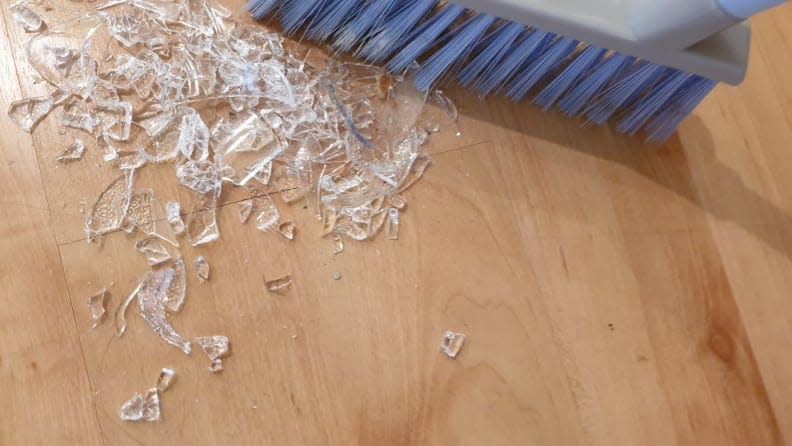 When cleaning up broken glass, try to use a vacuum (if you have access to power) to collect the small yet sharp shards that are easy to miss with a broom.