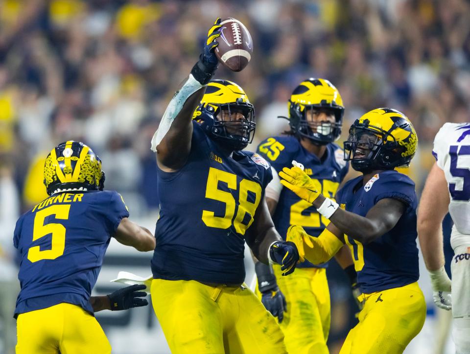 Michigan defensive tackle Mazi Smith was taken with the 26th overall pick in Thursday night's first round of the NFL draft. He's expected to reinforce the Cowboys' run defense, which ranked No. 22 in the league last season.