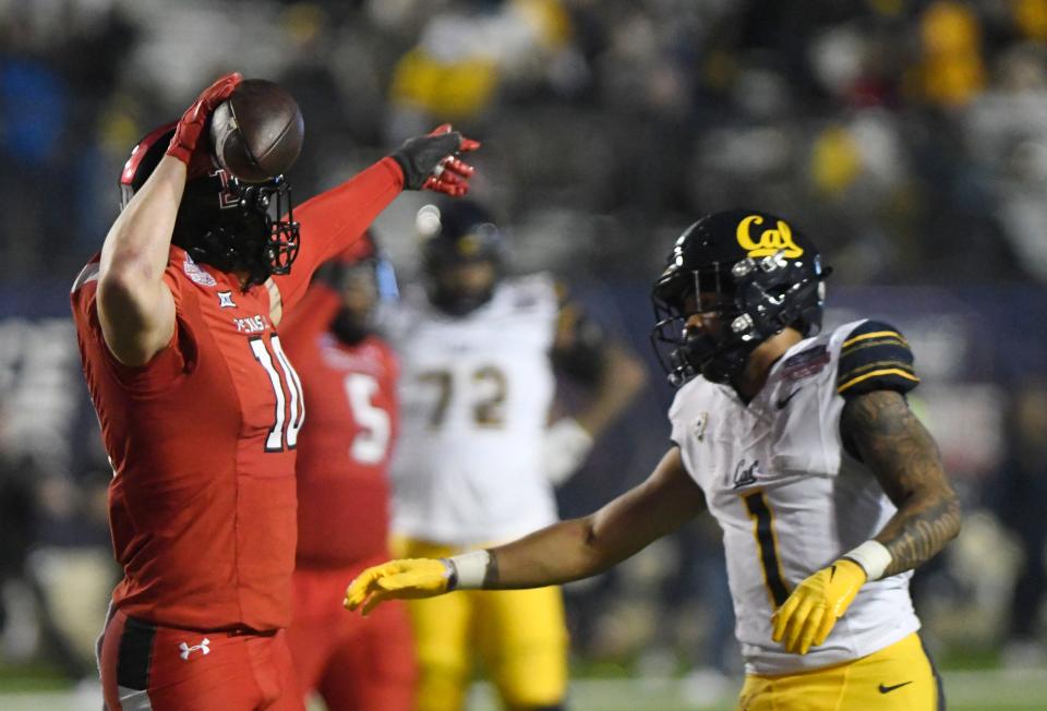 Texas Tech inside linebacker Jacob Rodriguez (10) signals in celebration after intercepting a pass in the Red Raiders' Independence Bowl victory over California. Rodriguez was named the game's outstanding defensive player after he was credited with eight tackles, the interception, a pass breakup and a forced fumble.