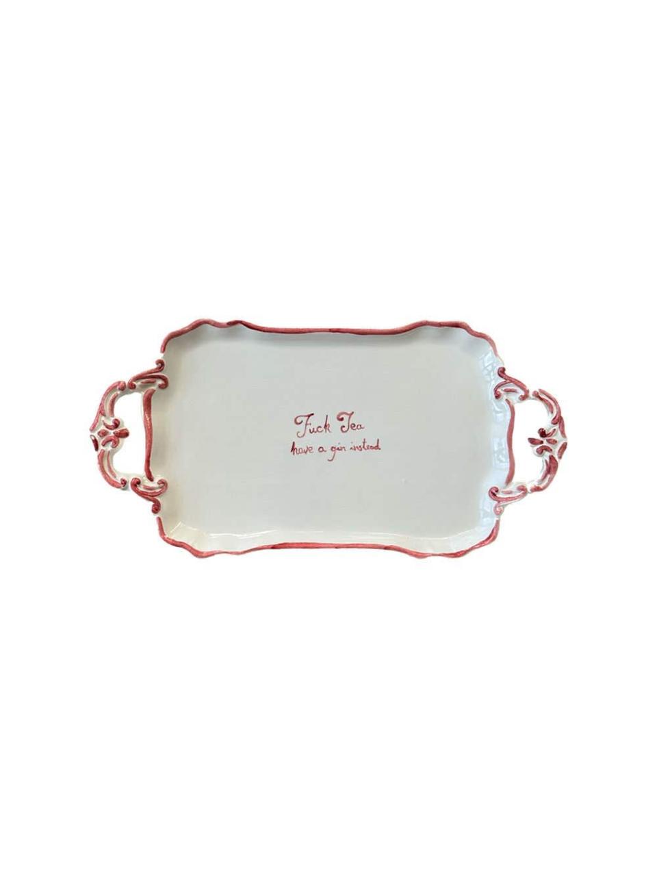 <p><a href="https://go.redirectingat.com?id=74968X1596630&url=https%3A%2F%2Fshop.harpersbazaar.com%2F65b9d77b3be40-f-tea-tray.html&sref=https%3A%2F%2Fwww.harpersbazaar.com%2Fculture%2Finteriors-entertaining%2Fa46792586%2Fhow-to-update-your-space-into-a-parisian-home%2F" rel="nofollow noopener" target="_blank" data-ylk="slk:Shop Now;elm:context_link;itc:0;sec:content-canvas" class="link ">Shop Now</a></p><p>F*** Tea Tray</p><p>harpersbazaar.com</p><p>$85.00</p>