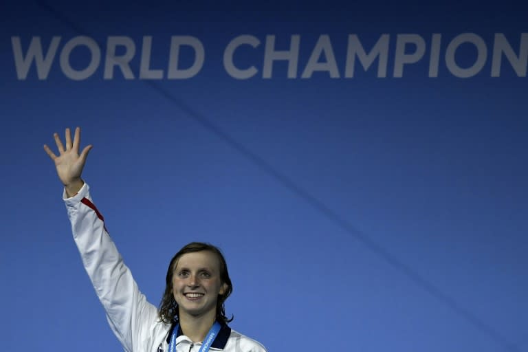 American Katie Ledecky celebrates on the podium after the women's 1500m freestyle final on July 25, 2017