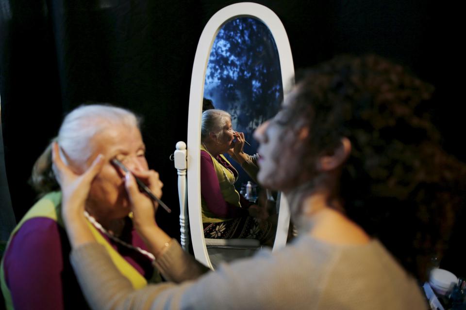 Sarah Israel, a Holocaust survivor, has her make-up done during preparations ahead of a beauty contest for survivors of the Nazi genocide in the northern Israeli city of Haifa