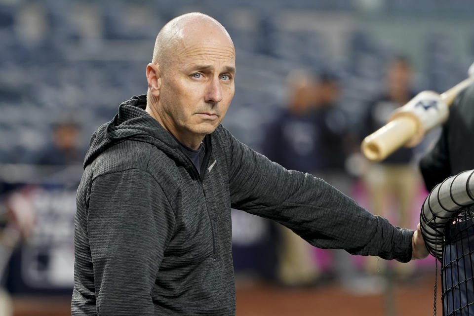 New York Yankees general manager Brian Cashman attends batting practice during a workout ahead of Game 1 of baseball's American League Division Series against the Cleveland Guardians, Monday, Oct. 10, 2022, in New York. (AP Photo/John Minchillo)