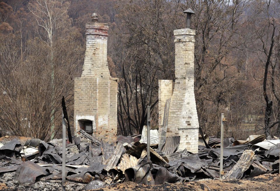 Two brick fireplaces are all that are left of a historic town store at Nerrigundah, Australia, Monday, Jan. 13, 2020, after a wildfire ripped through the town on New Year's Eve. The tiny village of Nerrigundah in New South Wales has been among the hardest hit by Australia's devastating wildfires, with about two thirds of the homes destroyed and a 71-year-old man killed. (AP Photo/Rick Rycroft)