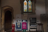 A sign reading "Keep Calm and Pray" sits at the side entrance of the Anglican St. Mary's Church in Northchurch, England, opened up for in-person prayer on Friday, May 22, 2020. When the Church of England closed all its buildings, the Rev. Jonathan Gordon began recording and broadcasting weekly services on a smartphone with the help of his wife, Rachel Gordon. "It posed an immediate and immense challenge," the Rev. Gordon said. "It meant that we had to completely rethink how we did everything." (AP Photo/Elizabeth Dalziel)