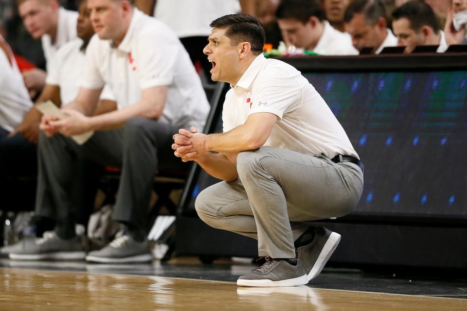 Cincinnati Bearcats head coach Wes Miller shouts from the sideline in the first half of the NCAA American Athletic Conference basketball game between the Cincinnati Bearcats and the Memphis Tigers at Fifth Third Arena in Cincinnati on Tuesday, Feb. 15, 2022. 